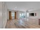 Open living room features wood floors, recessed lighting, and sliding glass doors to the backyard at 109 Reverie Heights Ave, Henderson, NV 89011