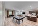 Spacious open floor plan with a pool table, dining area, and comfortable living space with outdoor access at 109 Reverie Heights Ave, Henderson, NV 89011