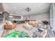 Open-concept living space with leather seating, a modern kitchen, and a game area with a pool table at 109 Reverie Heights Ave, Henderson, NV 89011