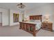 Bedroom with a unique wood bed frame, decorative lighting, and artwork, creating a cozy retreat at 109 Reverie Heights Ave, Henderson, NV 89011