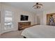 Spacious bedroom with a decorative cabinet and outdoor access at 109 Reverie Heights Ave, Henderson, NV 89011