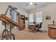 Bright office with neutral walls, a ceiling fan, and a sleek wooden desk at 109 Reverie Heights Ave, Henderson, NV 89011