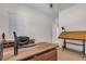 Large home office with windows and modern wood desk at 109 Reverie Heights Ave, Henderson, NV 89011