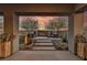Inviting outdoor living space with a modern fireplace and comfortable seating area at 109 Reverie Heights Ave, Henderson, NV 89011