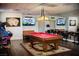 Entertainment room featuring a pool table, arcade game, TVs and comfortable seating at 109 Reverie Heights Ave, Henderson, NV 89011