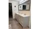 Well-lit bathroom featuring double sinks and modern fixtures at 1305 Shenandoah St, Boulder City, NV 89005