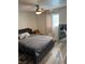 Bedroom featuring a bed with a gray cushioned headboard and a view of a large mirror at 1305 Shenandoah St, Boulder City, NV 89005