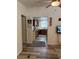 Interior view from the living room showcasing an entry door and view into the kitchen with wood-look flooring at 1305 Shenandoah St, Boulder City, NV 89005
