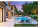 Beautiful backyard at dusk featuring a pool, lounge chairs, and golf course views at 15 Vintage Canyon St, Las Vegas, NV 89141