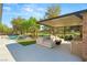 Wonderful backyard featuring a pool, lounge, fire pit, and outdoor kitchen with golf course views at 15 Vintage Canyon St, Las Vegas, NV 89141
