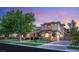 Stunning two-story home featuring stone accents, well-manicured landscaping, and a brick-paved driveway at 15 Vintage Canyon St, Las Vegas, NV 89141