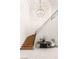 Elegant foyer showcasing a curved staircase with iron railing and stylish light fixture at 15 Vintage Canyon St, Las Vegas, NV 89141