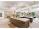 Expansive open-concept kitchen with double islands, tile floors, and ample room for cooking and dining at 15 Vintage Canyon St, Las Vegas, NV 89141