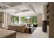 Bright living room featuring coffered ceilings, natural light, and seamless indoor-outdoor living at 15 Vintage Canyon St, Las Vegas, NV 89141