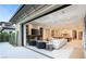Open-concept living space with floor-to-ceiling doors, fireplace and a seamless indoor/outdoor flow at 15 Vintage Canyon St, Las Vegas, NV 89141
