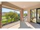 Beautiful patio with views of golf course, mountains, and a stone column feature at 15 Vintage Canyon St, Las Vegas, NV 89141