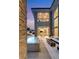 Beautiful outdoor space featuring a pool, a lounge area with a fireplace, and an outdoor dining area at 15 Vintage Canyon St, Las Vegas, NV 89141