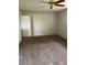 Bedroom with a ceiling fan and neutral walls and carpet flooring at 158 Greenbriar Townhouse Way, Las Vegas, NV 89121