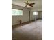 Spacious bedroom with mirrored closet doors and large window at 158 Greenbriar Townhouse Way, Las Vegas, NV 89121