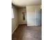 Bedroom with a window and neutral colored walls and flooring at 158 Greenbriar Townhouse Way, Las Vegas, NV 89121