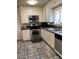 Kitchen area features modern appliances, counters and cabinets at 158 Greenbriar Townhouse Way, Las Vegas, NV 89121