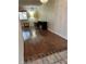 Living room showing wood floors, window, and built in shelves at 158 Greenbriar Townhouse Way, Las Vegas, NV 89121