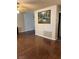 Spacious living room with hardwood floors, ceiling fan, painting and air vent at 158 Greenbriar Townhouse Way, Las Vegas, NV 89121