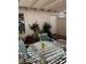 Charming patio with outdoor seating, potted plants, and a tranquil setting at 158 Greenbriar Townhouse Way, Las Vegas, NV 89121