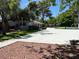 Community pool area featuring a club house, mature trees and open space at 158 Greenbriar Townhouse Way, Las Vegas, NV 89121