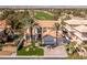 Aerial view of a well-maintained home with a pool and manicured landscaping at 1613 Iron Ridge Dr, Las Vegas, NV 89117
