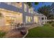 Expansive backyard featuring a covered patio, lush lawn, and seamless transition to the indoors at 1613 Iron Ridge Dr, Las Vegas, NV 89117