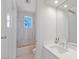 Modern bathroom with updated vanity, contemporary fixtures, and tiled shower-tub combination at 1613 Iron Ridge Dr, Las Vegas, NV 89117