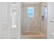 Updated bathroom featuring a sleek vanity, contemporary fixtures, and a tiled shower-tub combination at 1613 Iron Ridge Dr, Las Vegas, NV 89117