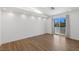Bright, airy bedroom with wood floors, recessed lighting, and access to a private balcony at 1613 Iron Ridge Dr, Las Vegas, NV 89117