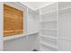 Walk-in closet with custom shelving and cedar paneling adding warmth and organization at 1613 Iron Ridge Dr, Las Vegas, NV 89117