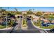 Elegant community entrance features a grand gate, lush landscaping, and decorative water features creating a resort-like ambiance at 1613 Iron Ridge Dr, Las Vegas, NV 89117