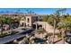 Picturesque community entrance with water features, mature palms, and controlled access at 1613 Iron Ridge Dr, Las Vegas, NV 89117