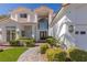 Attractive two-story home with beautiful front garden and brick walkway at 1613 Iron Ridge Dr, Las Vegas, NV 89117