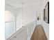 Bright hallway featuring chandelier and wood floors at 1613 Iron Ridge Dr, Las Vegas, NV 89117
