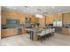 Expansive kitchen offers a large island, stainless steel appliances, and bright, warm-toned cabinetry at 1613 Iron Ridge Dr, Las Vegas, NV 89117