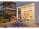 Outdoor dining space with brick patio, built-in grill, and easy access to indoor kitchen at 1613 Iron Ridge Dr, Las Vegas, NV 89117
