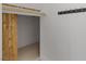 Walk-in closet featuring custom wood door, hooks and ample space at 1613 Iron Ridge Dr, Las Vegas, NV 89117