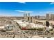 Expansive aerial view shows the city skyline and the Sahara Hotel under clear blue skies at 200 W Sahara Ave # 2407, Las Vegas, NV 89102