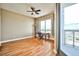 Spacious bedroom with hardwood floors, a ceiling fan, and balcony access with city views at 200 W Sahara Ave # 2407, Las Vegas, NV 89102