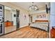 Bedroom with modern closet, chandelier and bed with neutral decor at 200 W Sahara Ave # 2407, Las Vegas, NV 89102