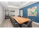 Well-lit conference room with a large wood table, black chairs, and elegant decor at 200 W Sahara Ave # 2407, Las Vegas, NV 89102