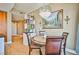 Charming dining area with chandelier, hardwood floors, and adjacent to kitchen at 200 W Sahara Ave # 2407, Las Vegas, NV 89102