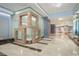 Modern hallway with marble floors, wood accents, and recessed lighting at 200 W Sahara Ave # 2407, Las Vegas, NV 89102