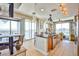 Open kitchen featuring stainless steel appliances, granite countertops and an island overlooking the city at 200 W Sahara Ave # 2407, Las Vegas, NV 89102