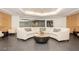 Comfortable lobby with a curved sofa, decorative pillows, and a modern coffee table at 200 W Sahara Ave # 2407, Las Vegas, NV 89102
